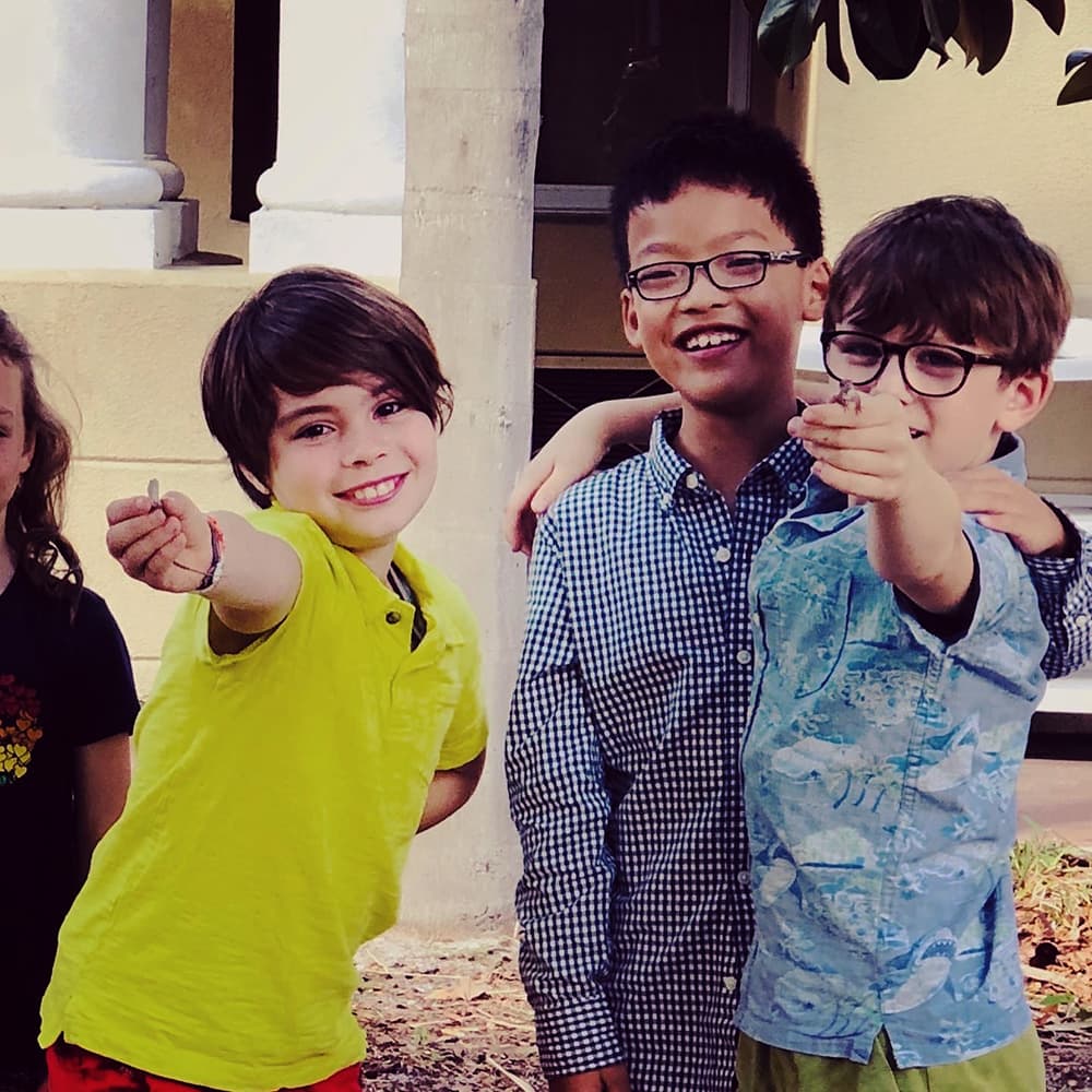 Teacher with young students at music lesson